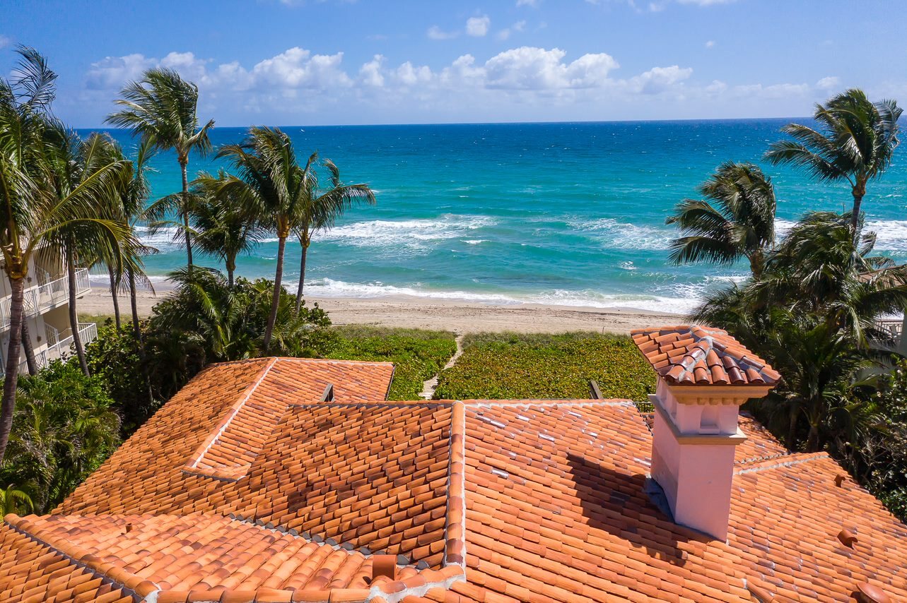 Completed coastal tile roof with ocean in the background.