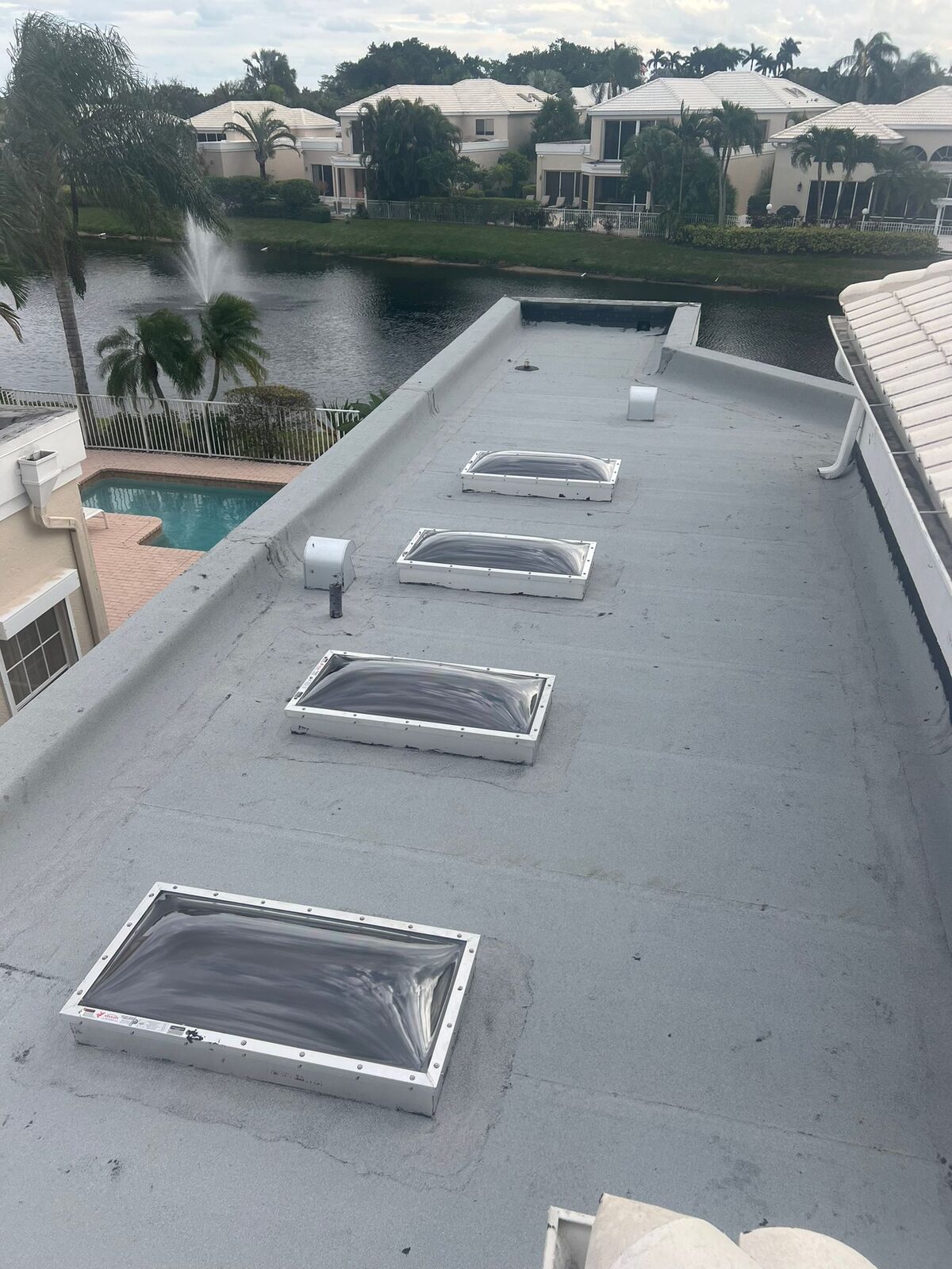 Completed low-slope roof with skylights.