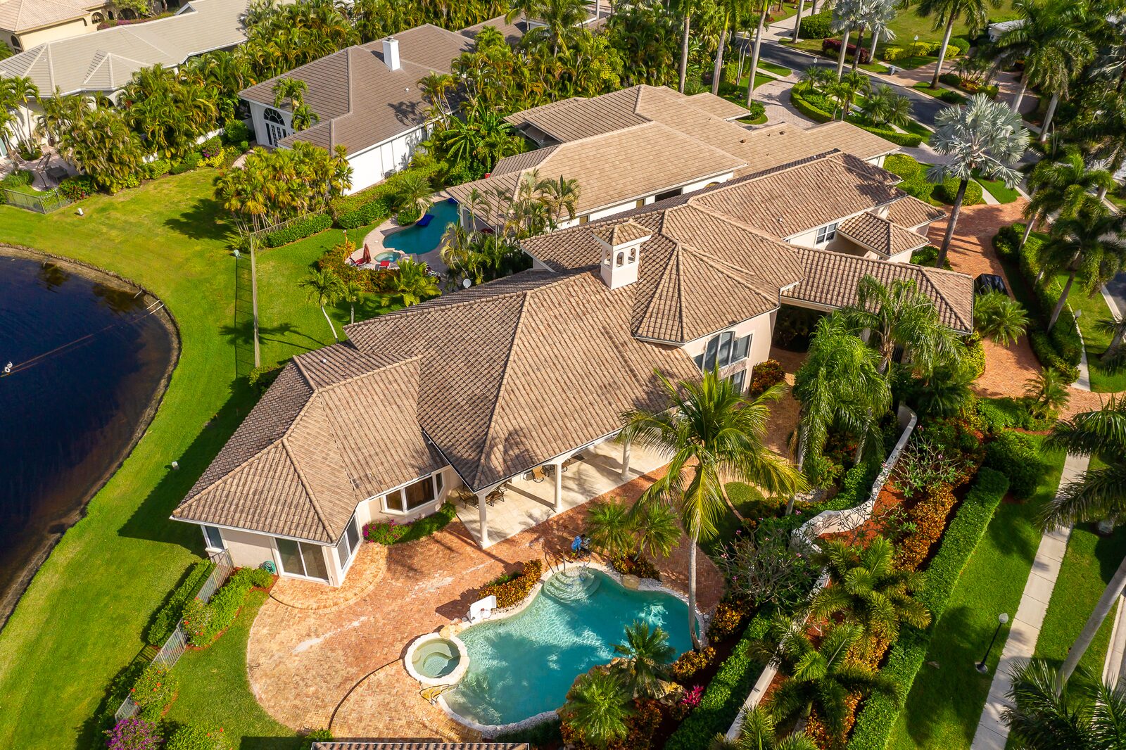 Weathered tile roof before replacement on a South Florida home.