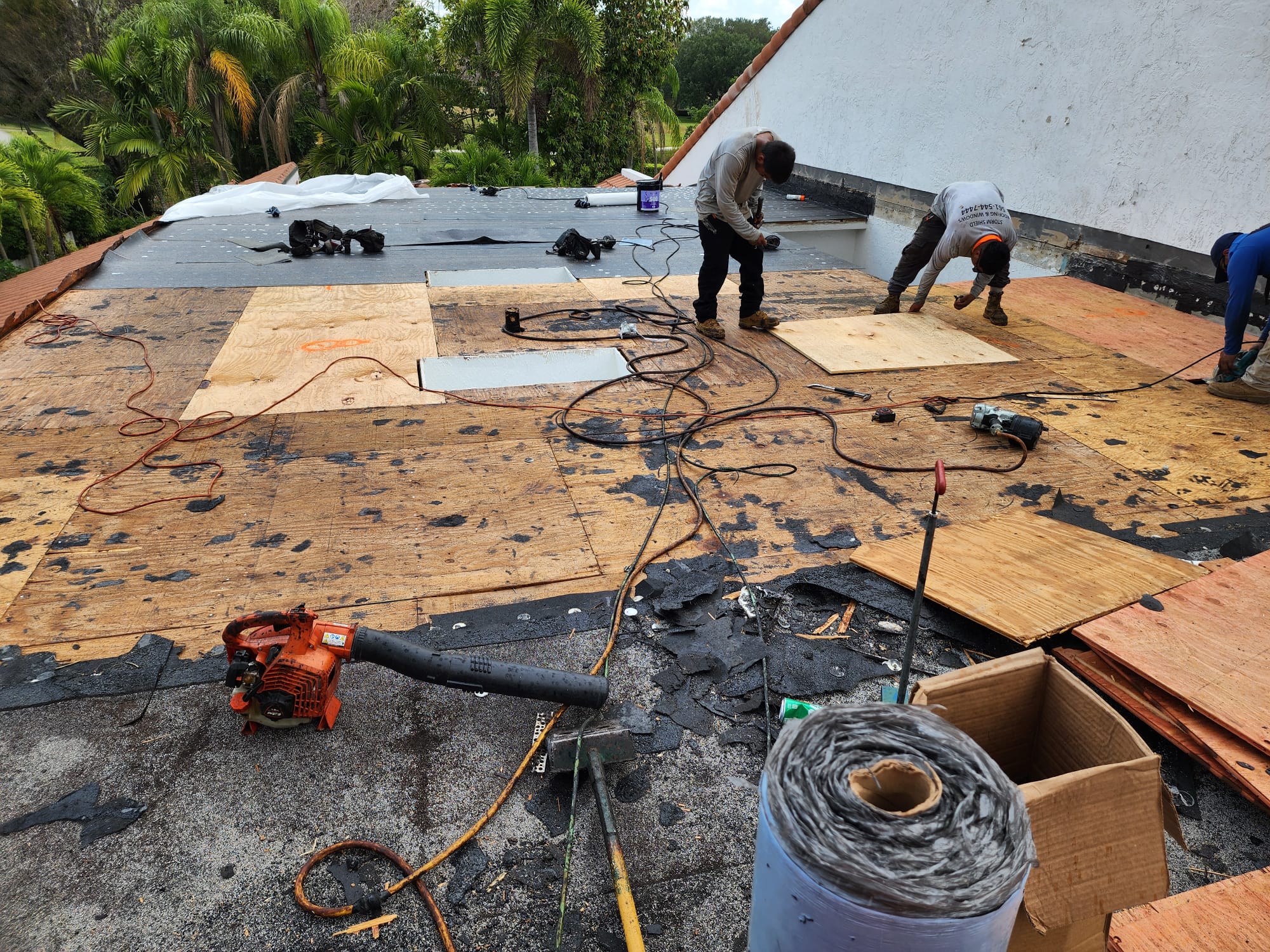 Roof repair and replacement work underway on a South Florida property.